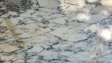 Natural marble Arabescato, black and white pattern from nature background with brown defect.