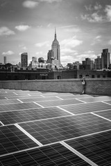Solar Panels on a roof in Manhattan with the Empire State Building in the Background