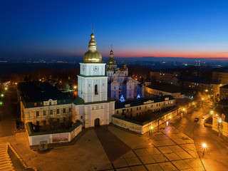 Fototapeta premium Evening down the golden domes of St. Michael's Cathedral, the eternal movement died down in the square,