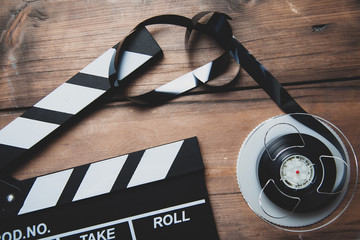 Cinema movie clapper board on the desk