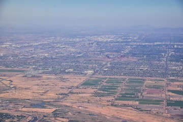 Arizona Rocky Mountains Aerial view from airplane of abstract Landscapes, peaks, canyons and rural cities flying in to Phoenix, AZ. United States of America. USA.