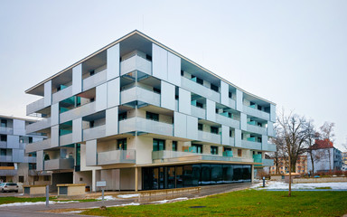 Modern residential apartment flat buildings exterior in Salzburg snow reflex