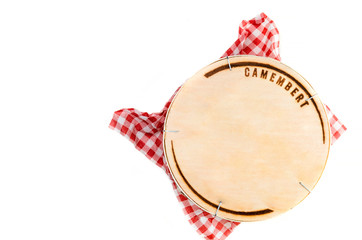 Wooden box with camembert cheese on white background - top view