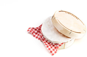 Camembert cheese in wooden box on white background - obrazy, fototapety, plakaty