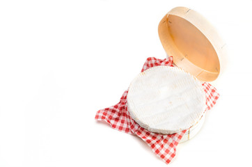 Camembert cheese in wooden box on white background