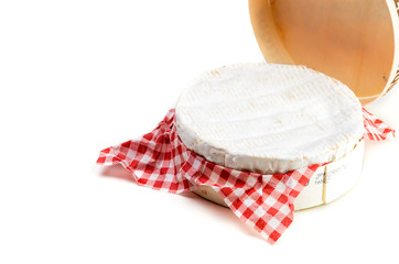 Camembert cheese in wooden box on white background - close up
