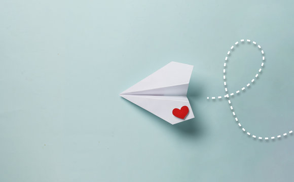 Naklejka paper love airplane on color background..The concept of a love message. Valentine's Day. Declare love. Love note.