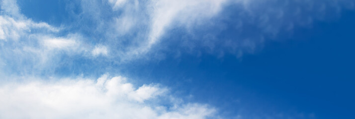 Naklejka na ściany i meble fluffy clouds in the blue sky, panoramic mock- up image