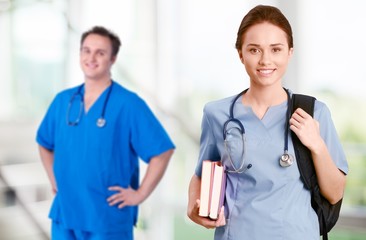 Nurse student man and woman with books and stethoscope