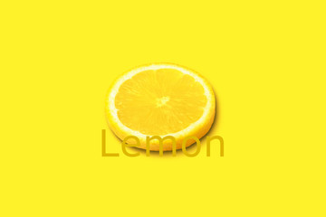 Lemon citrus slice on yellow background