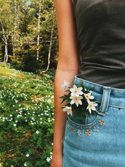 Flower in woman pocket