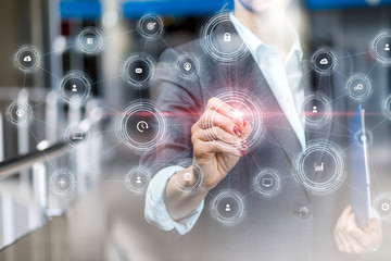 Businesswoman draws a structure of the process integration .