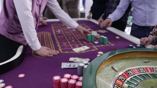 people play roulette in a casino