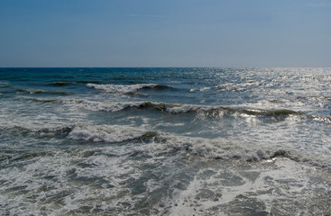 Sea surf on a sunny day.