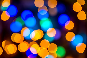 Christmas colorful bright background. Festive abstract bokeh, defocused large colored lights...