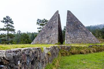 dramatic image of a stone pyramid in the Valle Nuevo National Park in the caribbean mountains of...