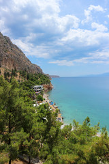 View to azure mediterranean sea near Nafplio, Greece with wild beach and abandoned hotel