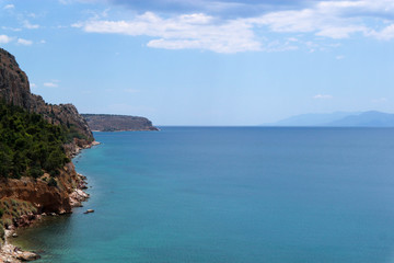Scenic view of the boundless Mediterranean Sea and coastline with pines and rocks