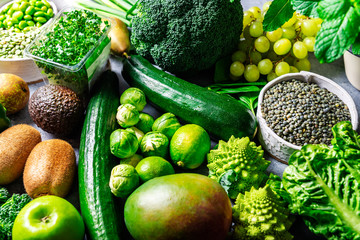 Variety of Green Vegetables and Fruits on the grey background