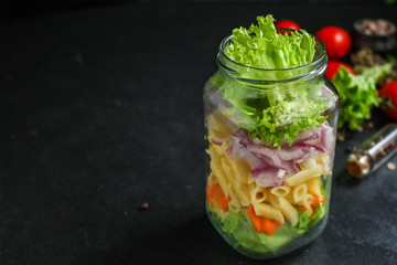 healthy salad in a jar (vegetable snack pasta salad) menu concept. food background. top view. copy space