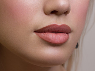Sexual full lips. Natural gloss of lips and woman's skin. The mouth is closed. Increase in lips,...