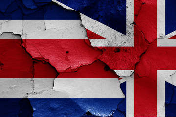 flags of Costa Rica and UK painted on cracked wall