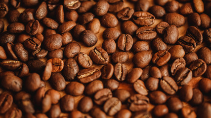 Coffee beans background. Closeup view. Background for website design or brochure on food concept. Filling for menu of cafe, restaurants, coffee shops. 16 in 9 banner crop