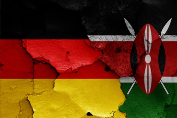 flags of Germany and Kenya painted on cracked wall