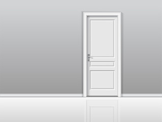 Closed white door in a white room