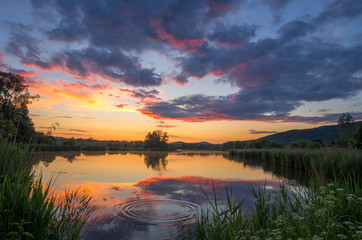 Fototapeta na wymiar beautiful sky colors at sunset on the lake