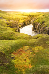 Narrow river between volcanic mountains in the geothermal area in Kerlingarfjoll near route f35 in Iceland