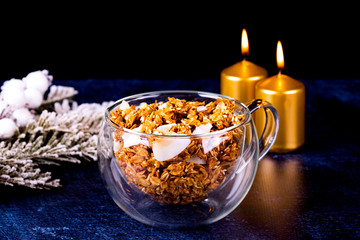 candle and pearls on wooden table