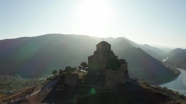 Aerial view of Jvari Monastery in Mtskheta city in summer sunshine.