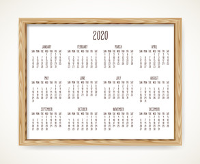 Year 2020 monthly calendar in a wooden frame