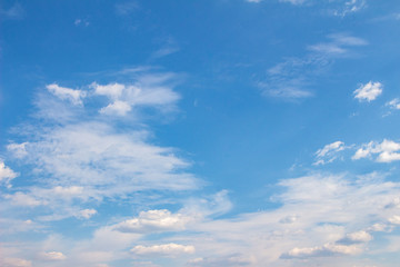 Naklejka na ściany i meble White clouds in the blue sky. Background. Texture