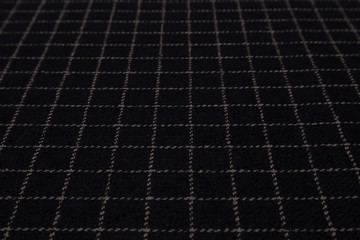 Close up of checkered fabric with textile texture background