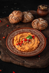 Healthy homemade creamy hummus with butter and paprika. Chickpeas beans. Vegetarian food. Source of...