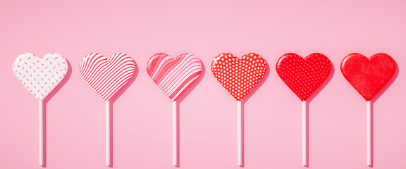 Flat lay lollipops on stick in row with different pattern textures, love concept, Valentines day pastel pink background 3d illustration