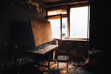 Interior of burnt by fire apartment building. Burned room inside with furniture