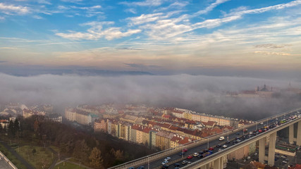 panoramic view of praha city center in low cloud cover