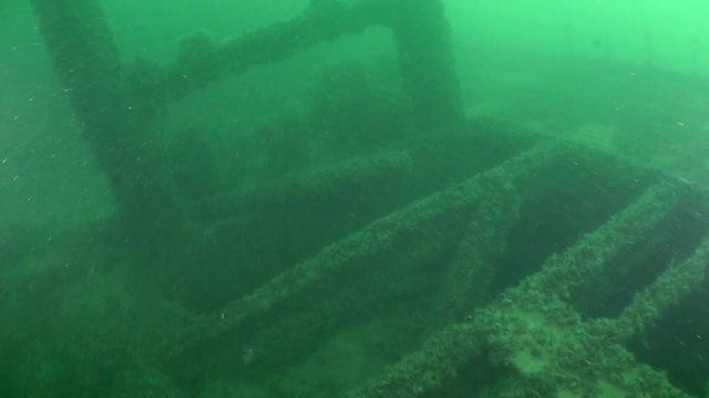Divers celebrate New Year under water: B-roll, cutaway: the camera moves along the deck of the sunken ship.