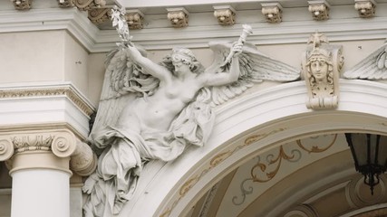 Angel statue with spread wings on Odessa Ukraine National Academic Theater - Powered by Adobe
