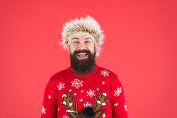 Man with long beard and mustache. Winter care. Emotional guy. Winter mood. Bearded hipster wear knitted sweater and furry hat. Weather forecast. Winter fashion. Cold days. Barbershop services