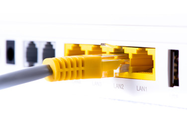 Macro of LAN ethernet port with network cable connected to router