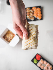 Japanese food sushi roll with raw fish and rice. delivery plastic boxes