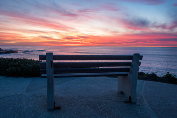 wooden bench at sunset