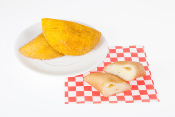 Tasty Colombian food, empanada made with cheese; photo on white background.