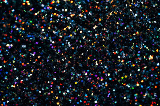 Texture made of black holographic sparkles. Creative party background.