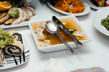 Beautifully served banquet table with cold, hot appetizers. Holiday table with various dishes, snacks, drinks. View from the top. 