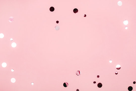 Falling Foil Confetti With Bottle Of Champagne And Circles On Pink Background. Party Concept